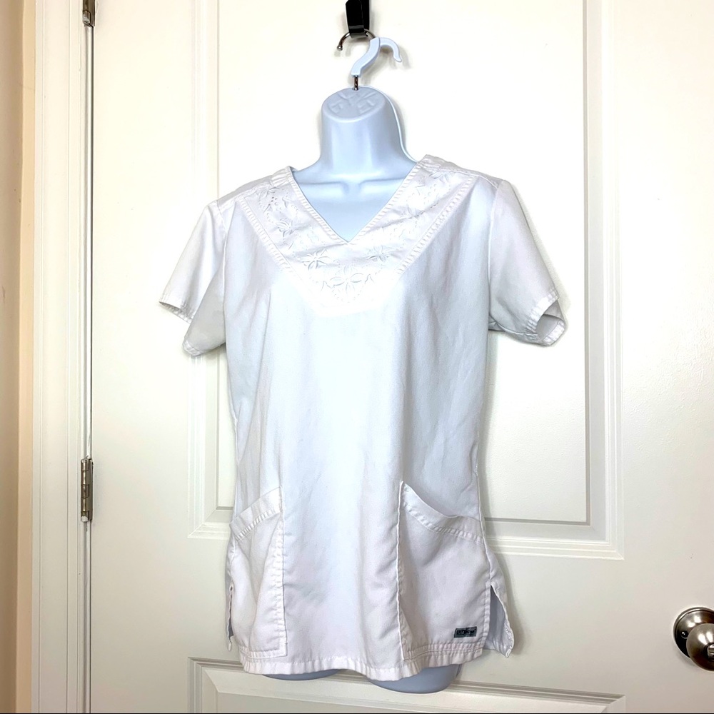 Grey’s Anatomy white scrub top. Patterned neckline. Medium